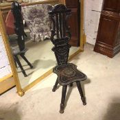 A 1920s spinning stool with pierced and carved splat, on turned splay supports (92cm x 29cm x 33cm)