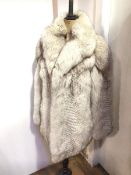 A fur coat bearing Saga Fox to interior (shoulders: 25cm x length: 76cm)