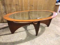 A G Plan oval teak coffee table, with glass top on curved supports (42cm x 122cm x 65cm)