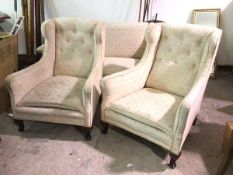 A pair of 1920s wing back armchairs, possibly Whytock & Reid, with button backs and outward angled