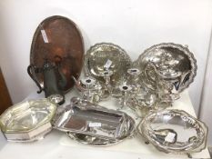 A large quantity of silver plate including pierced footed trays, teapot, sauceboats, serving trays