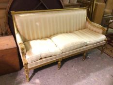 A gilt wood Napoleon III style three seater canope, with striped upholstery, on moulded supports (