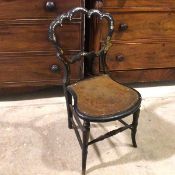 A Victorian ebonised side chair, with mother of pearl inlay and gilt decoration, on turned front