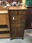 A 1920s/30s reproduction Georgian style mahogany tall chest of drawers fitted two short drawers