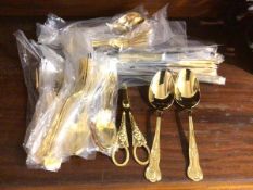 A set of Viners gilt metal flatware including twelve dinner forks (21cm), dinner knives, serving