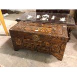 A Chinese carved camphorwood chest, with carved panels depicting Chinese scenes, unfitted