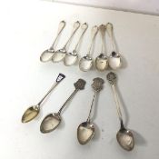 A set of six Edwardian London silver coffee spoons and four silver souvenir spoons (combined: 113g)