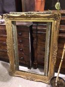 A composition gilt moulded frame, some losses (internal: 77cm x 113cm) and another (2)