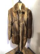 A fur coat with pockets to side (shoulders: 25cm x length: 62cm)