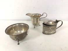 A 1920s London silver footed bowl with matching milk jug and a Birmingham silver condiment pot (