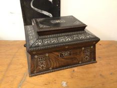 A 19thc Anglo Indian rosewood sarcophagus shaped casket with mother of pearl inlay and beaded edges,