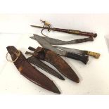 Two WWII period kukris, in leather scabbards and a bone handled steel blade Dah style dagger and