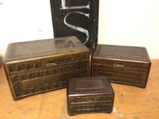 A graduated set of three carved Indian boxes (largest: 16cm x 31cm x 19cm)