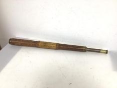 An Edwardian single draw telescope inscribed Dollond, London above initials, also with applied key