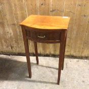 An early 20thc mahogany bedside table with bow front, fitted single frieze drawer, on straight