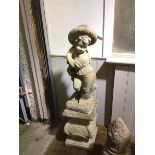 A composition garden statuary, Boy with Hat, on plinth base (110cm)