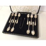 A set of ten 1930s Birmingham silver coffee spoons with sugar nips, in original box (combined: 172.