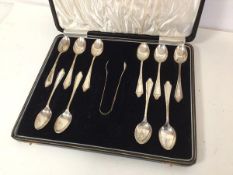 A set of ten 1930s Birmingham silver coffee spoons with sugar nips, in original box (combined: 172.