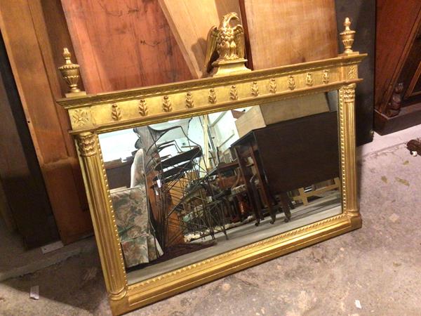 A Regency style gilt mirror, with bird surmount and urn finials, on corinthian pilasters (87cm x