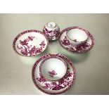 A set of three 19thc Sevres style tea bowls and saucers decorated with handpainted gilt and pink
