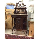 A late Victorian side cabinet, the superstructure with elaborately carved crest above a shelf and