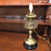 A converted oil lamp, wired for electricity, lamp stamped Young's screw fitting (40cm to top of