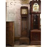 An Edwardian oak longcase clock, the metal dial with gilt corners and roman numerals within an egg