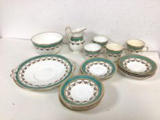 A part late 19thc/early 20thc teaset, with four teacups (7cm), eleven saucers, milk jug, bowl and