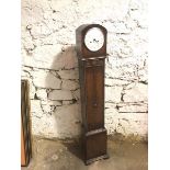 A 1940s/50s oak longcase clock of small proportions, the enamelled dial with arabic numerals (