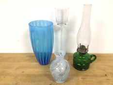 An oil lamp with green glass base with handle to side, with shade (38cm), a blue glass vase, a cased