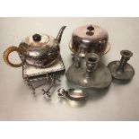 An Epns engraved teapot with raffia covered handle, a tile kettle stand, an Epns muffin dish