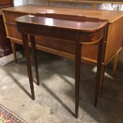 A reproduction mahogany and satinwood console table, with ledgeback, D end top, on straight tapering