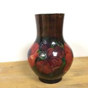 A Moorcroft baluster vase with Poppy decoration, with William Moorcroft signatures to base and