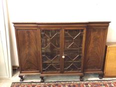 A reproduction Georgian style breakfront bookcase, with two glazed doors enclosing adjustable shelf,