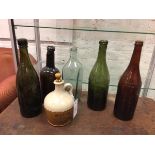 A collection of bottles including one possibly 18thc and three other bottles, one inscribed Ind Cope