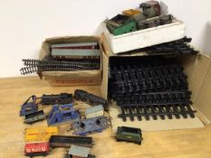 Train interest: a quantity of track and diecast trains and carriages, most stamped Hornby