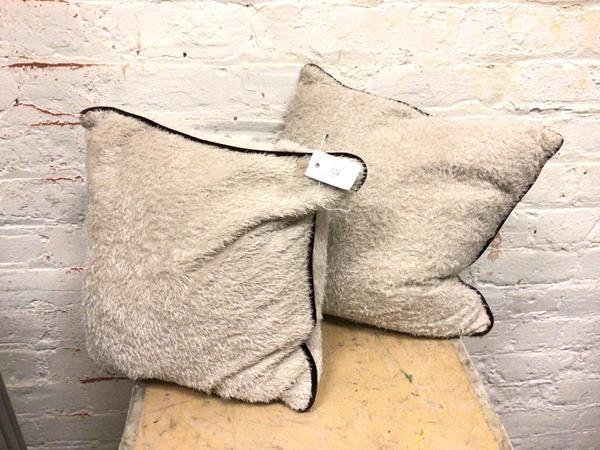 A pair of Oka faux fur feather filled cushions (40cm x 40cm)