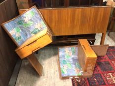 A mid century teak headboard with two matching bedside cabinets, with raised stained glass panels,