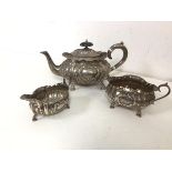 An 1899 London silver teapot with creamer and sugar bowl (770g)