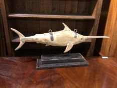 A folk art style Bill Fish, styled as a shop sign, on two tier base (34cm x 72cm x 17cm)