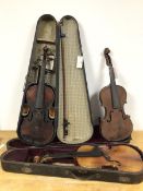 A group of three violins, two with original travelling cases, with one bow (all: 59cm)