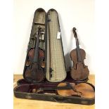 A group of three violins, two with original travelling cases, with one bow (all: 59cm)