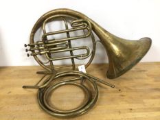 A French horn with associated parts (a/f), stamped Hawkes & Son London (60cm)