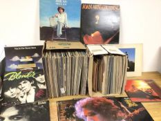 A large collection of vinyl records including Isaac Hayes, Neil Young, Beethoven, Ella Fitzgerald