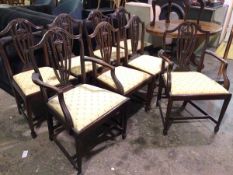 A set of eight George III style dining chairs, including two carvers and six side chairs, with