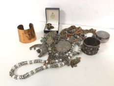 A collection of costume jewellery including gilt metal cufflinks and tie clip, with unworked stone