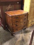 A 1930s/40s bow fronted chest of drawers with burr walnut veneer, the moulded top above four