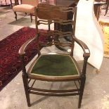 A 1930s/40s Georgian style mahogany open armchair with pierced ladder back, with padded