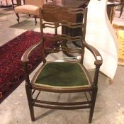 A 1930s/40s Georgian style mahogany open armchair with pierced ladder back, with padded