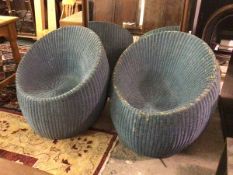 A pair of wicker verandah chairs of circular form, with sunken seats, painted blue (80cm x 80cm)